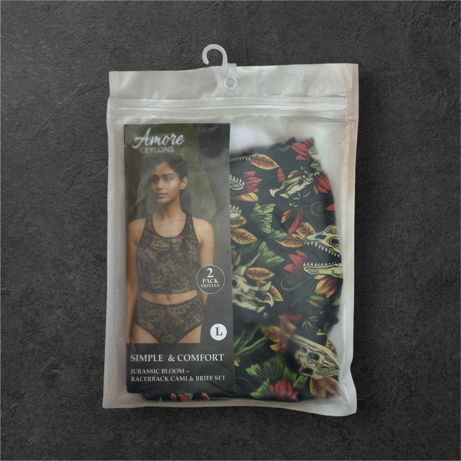 Packaged women's underwear set with floral design on a dark background