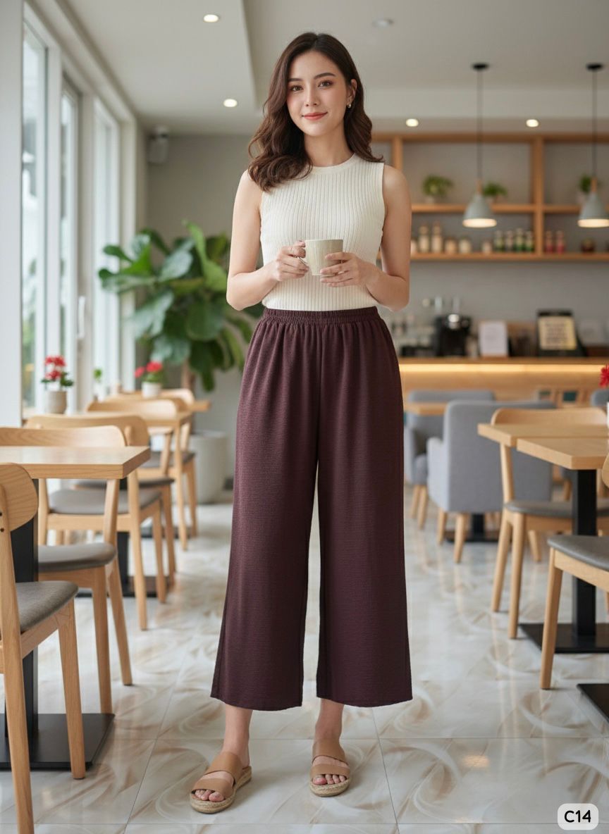 Woman holding a cup in a modern cafe setting