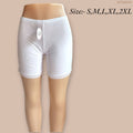 White shorts with lace trim on a beige background